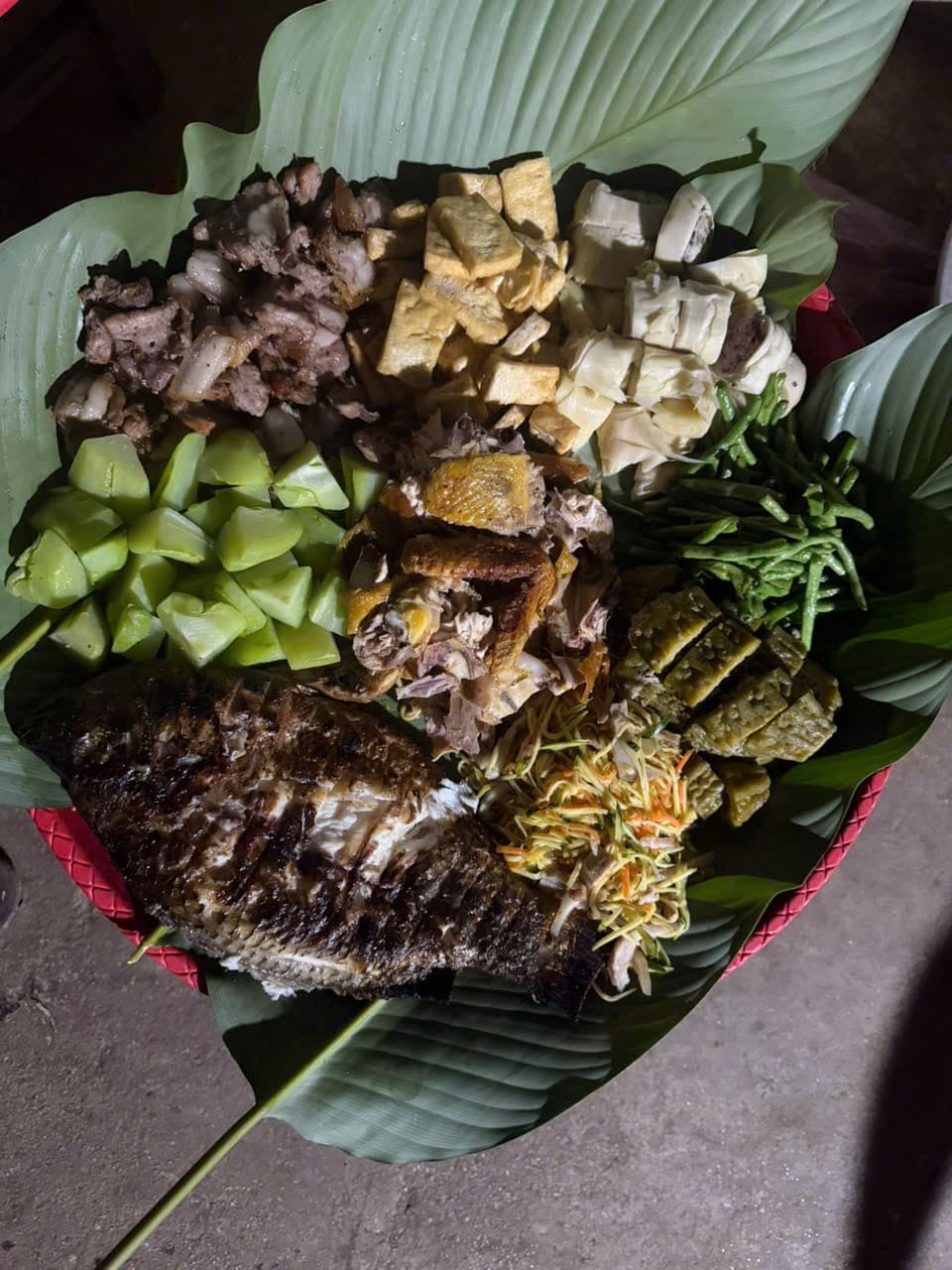 A BBQ feast served on banana leaves